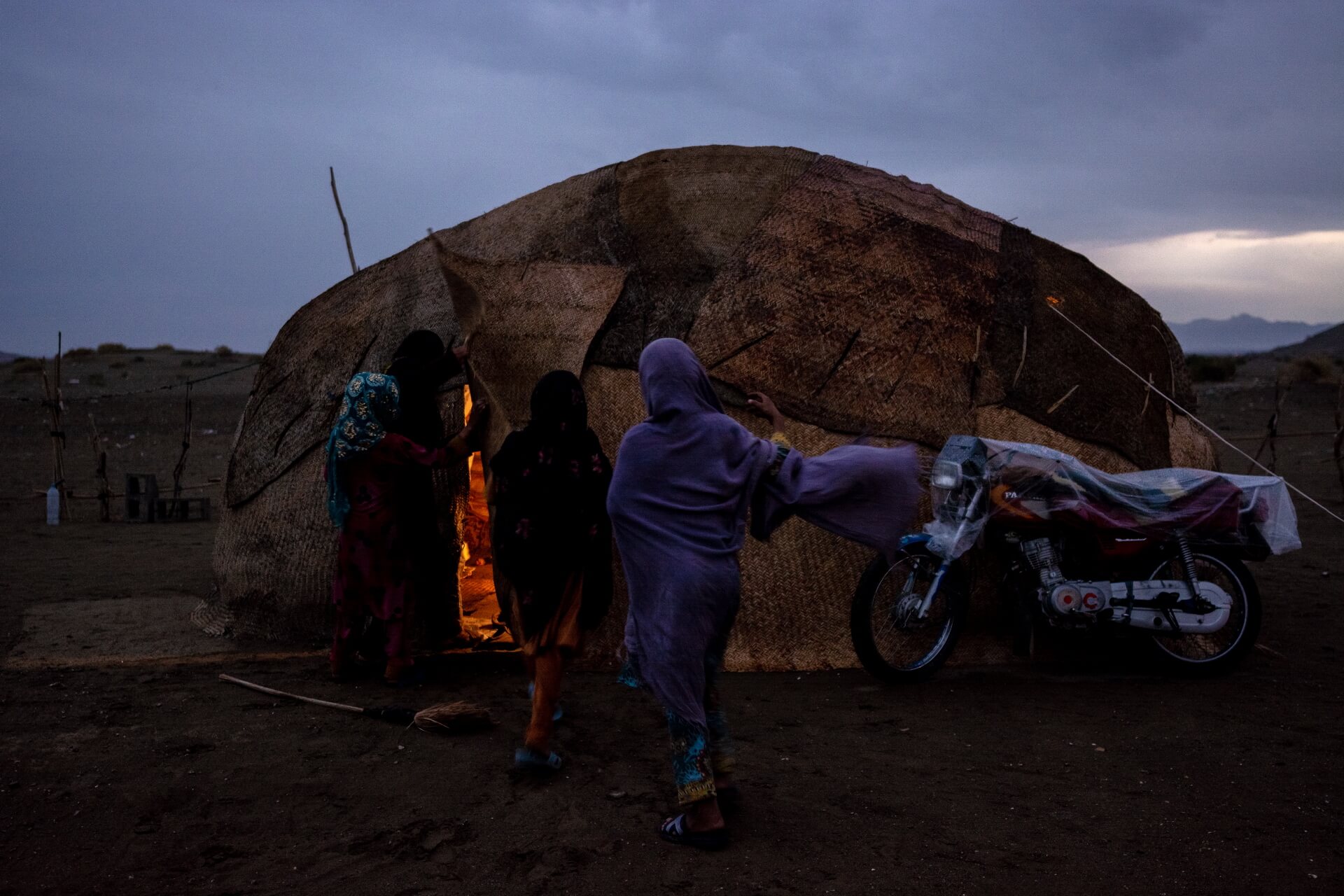 10 February 2019
Too Rig 3, Sowlan, Kerman Province, Iran
It's raining. The motorcycle is covered with plastic. The family gathered in the tent of Belgeys around the fire.
